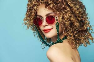 woman Curly hair smile red lips sunglasses blue photo