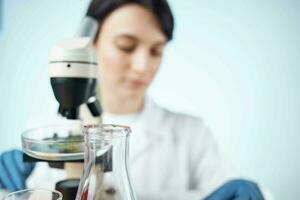 woman scientists microscopes research diagnostics work photo