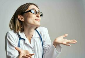 portrait of female doctor in medical gown and blue stethoscope cropped view photo