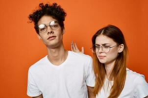 young couple in white t-shirts emotions fun moda communication photo