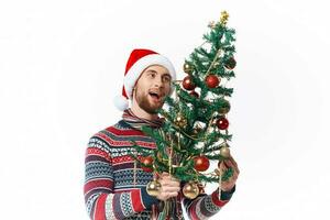 emotional man in New Year's clothes decoration christmas studio posing photo