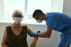 a doctor injects an elderly woman a patient with a covid vaccine passport photo