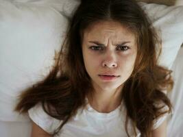 disappointed woman lying in bed dissatisfaction close-up photo