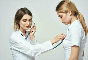 professional doctor with stethoscope heartbeat patient health work photo