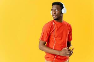 african man in t-shirt with headphones music fashion photo