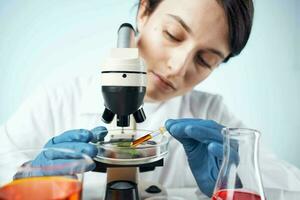 woman laboratory assistant microscope research diagnostics science work photo