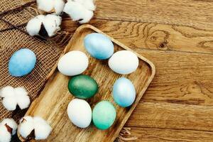 painted easter eggs on wooden board decoration tradition spring holiday photo