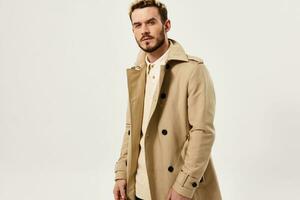 handsome man in coat fashion glamor attractive look modern style photo