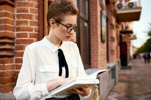 student on the street near the building rest communication photo