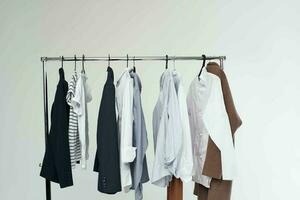 Clothing rack on white background photo