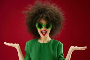 woman in green sunglasses posing afro hairstyle photo