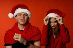 young couple in santa hats fun new year holiday studio Lifestyle photo