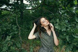 Woman outdoors Green leaves of a tree fresh air closed eyes trees photo