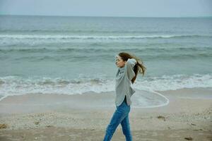 beautiful woman with long hair on the beach nature landscape walk Lifestyle photo