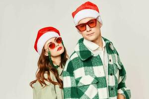 young couple wearing black glasses christmas hats together romance holiday photo