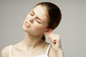 woman ear pain otitis media health problems infection light background photo