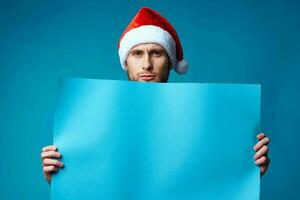 Cheerful man in a christmas blue mockup Poster isolated background photo