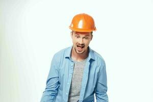 man in orange helmet Professional Job isolated background photo