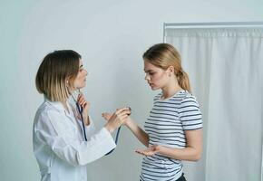 woman at the doctor's appointment medical gown stethoscope health photo