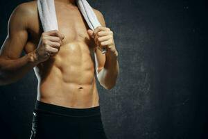 man athlete inflated body workout gym dark background photo