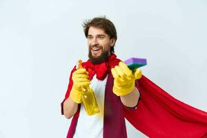Man in red raincoat cleaning supplies housework service Professional photo