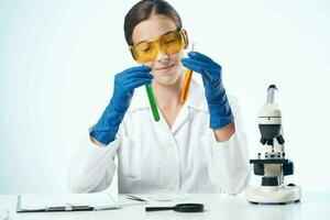 female laboratory assistant desktop chemical solution science Professional photo