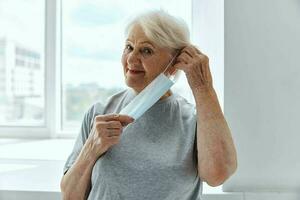 elderly woman medical mask respiratory protection photo