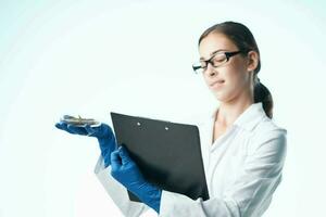 Cheerful woman laboratory assistant documents soil research biology photo
