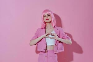 Positive young woman bright makeup pink hair glamor Studio Model photo