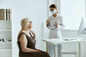 nurse in white coat discussion with the patient medical specialist photo