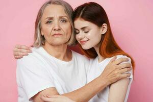 Mom and daughter in white t-shirts hug together family friendship photo