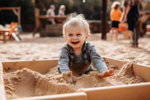 A happy small child playing in a sandbox created with technology. photo