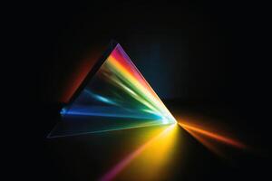 A prism dividing a lightbeam into the spectral colors created with technology. photo
