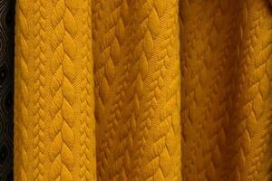 Detailed close up view on samples of cloth and fabrics in different colors found at a fabrics market photo