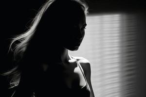 A Woman in light and shadow in black and white created with technology. photo