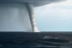 A tornado made of water over the ocean created with technology. photo