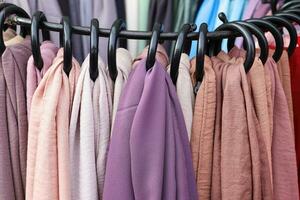 Detailed close up view on samples of cloth and fabrics in different colors found at a fabrics market photo