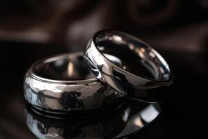 Two wedding rings made of liquid mercury created with technology. photo