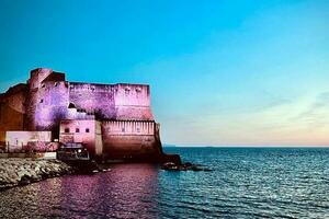 Castel dell'Ovo in Naples, at sunset photo