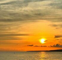 Sunset over the sea on a late summer day photo