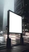 A large billboard on a city street at night. photo