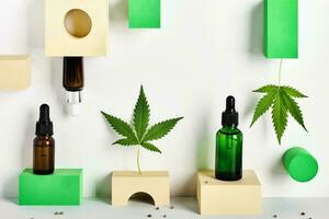 Cosmetic products with CBD oil and hemp extract. Glass bottles and hemp leaf on abstract geometric podiums photo