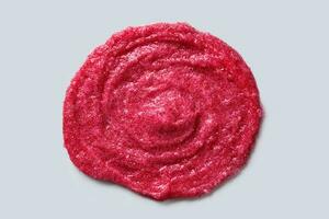 Circular Smear of Exfoliating Scrub with berry and sugar. Close-up photo