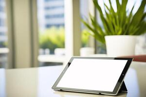 Tablet computer with Blank screen on a blurred office background. illustration photo