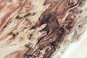 Fluid Art acrylic paints. Abstract mixing brown, black and white waves. Liquid flows splashes. Marble effect background or texture photo