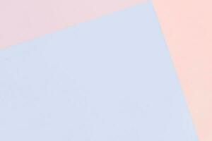 Paper geometric pastel background in pink and blue colors with copy space photo