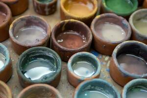 Peruvian paint cups photo