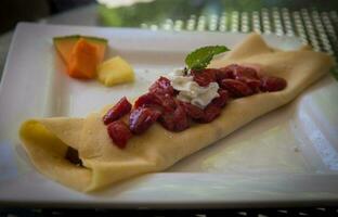 Strawberry Crepe garnished with Mint photo