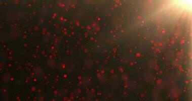 Red luxury bokeh on particles floating in the air. Dust and glitter particles backgrounds. Black backgrounds , Use blending mode screen. Loop Animation video