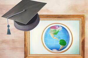 Top view of globe with diploma and copy space. photo